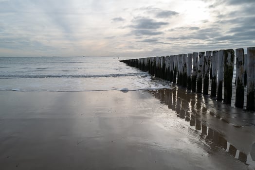 north sea coast, gloomy sunset behind rain clouds photo
