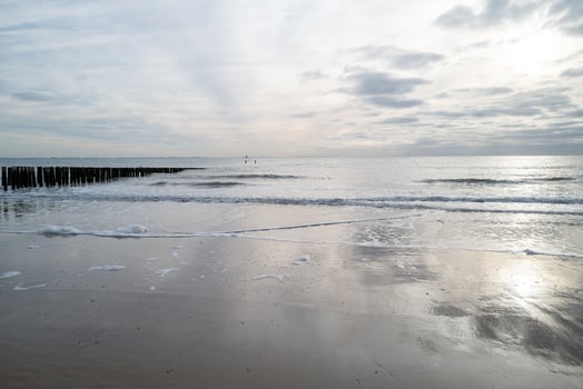 north sea coast, gloomy sunset behind rain clouds photo