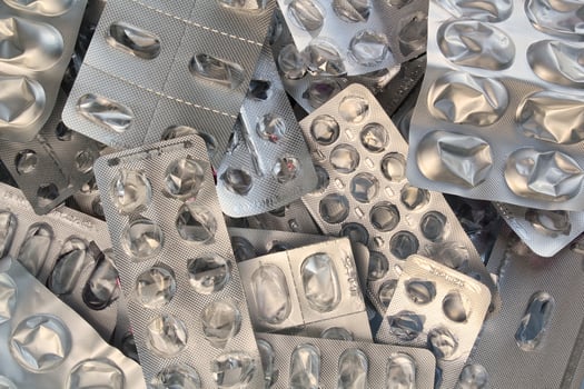 Pile of empty pill blister packs. Treatment and medication concept. Empty blister packages for recycling. Separate garbage sorting. Close up of clinical waste. Reducing medical waste disposal photo