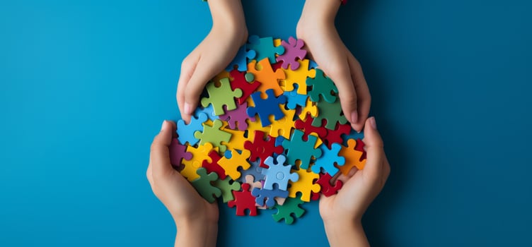 AI generated children's hands holding autism puzzle pieces on a blue background photo