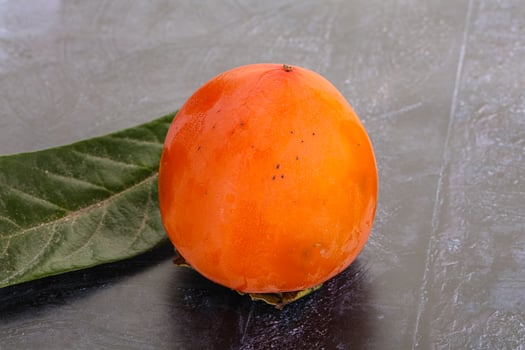 Fresh ripe sweet juicy persimmon photo