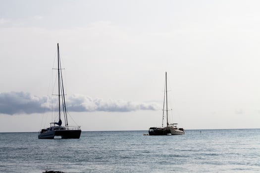 Kona, HI, 2011 - Two Catamaran Sailboats At Anchor photo