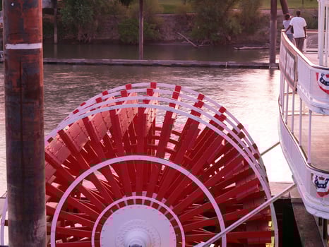 Sacramento, CA, 2007 - Red and white paddle wheel old boat on river photo