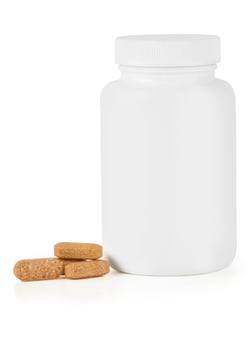 Pills vitamins on white photo