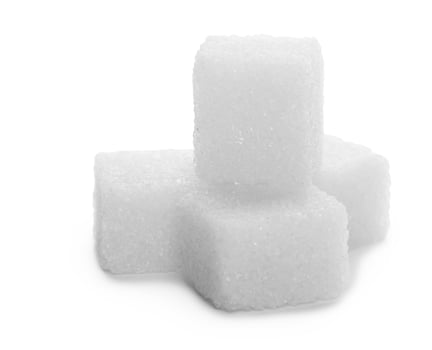 Sugar cubes on white photo