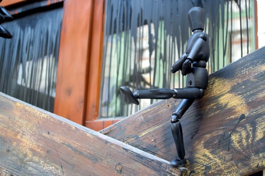 Little black manikins on a wooden boards. photo