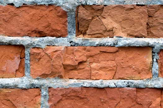 Red brick background. Textured brick wall. Old brick construction. photo
