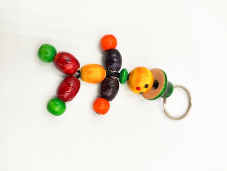 Vibrant Handcrafted Wooden Toys from India Colorful Objects on White Background for Stunning Product Photography photo