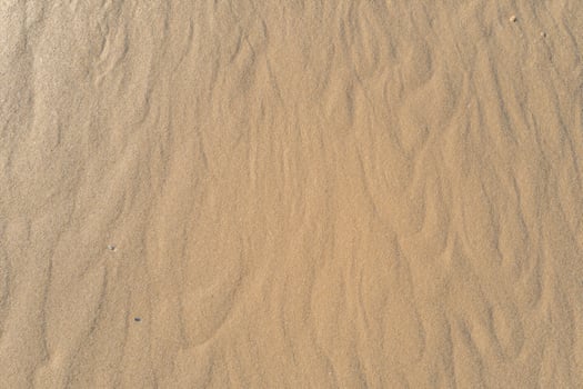 Horizon Haven Aerial Serenity Captures Beautiful Beach Sand from Above, a Tranquil Tapestry of Coastal Beauty photo