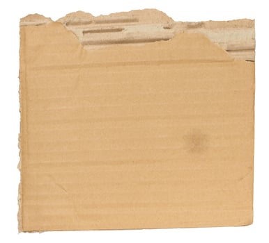 Piece of brown cardboard with torn edges on isolated background photo