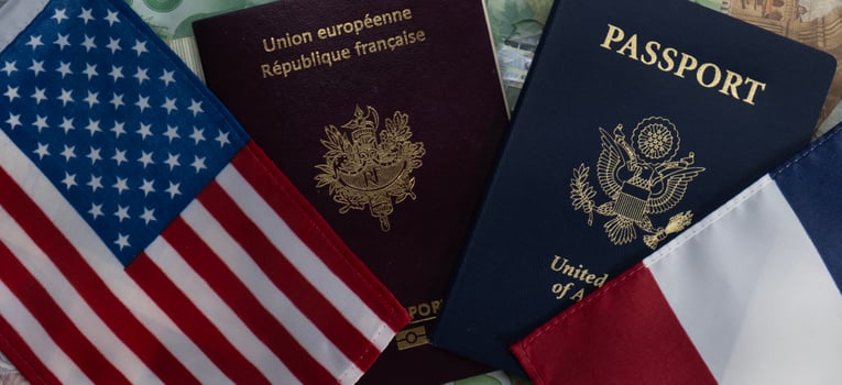 Flags of United States and France passports on currency transparent background photo