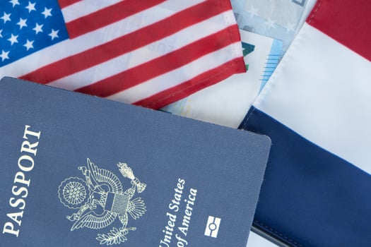 United States passport on Euro currency French and U.S. Flags photo