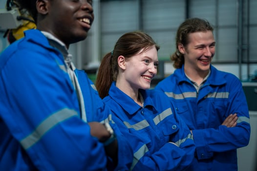 Portrait of Robotics engineers working with Programming and Manipulating Robot Hand, Industrial Robotics Design, High Tech Facility, Modern Machine Learning. Mass Production Automatics. photo
