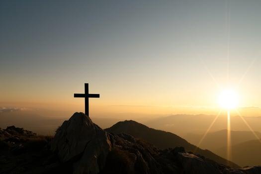 AI generated cross on the mountain, symbol of the crucifixion in the rays of the rising sun, faith, hope photo