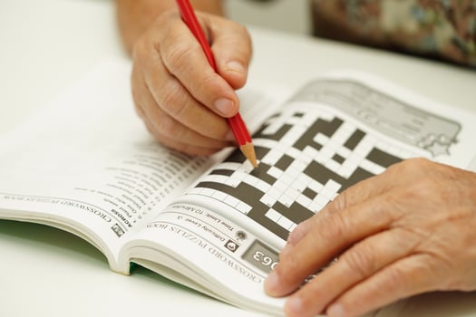 Bangkok, Thailand - May 15, 2022 elderly woman playing sudoku puzzle game for treatment dementia prevention and Alzheimer disease. photo