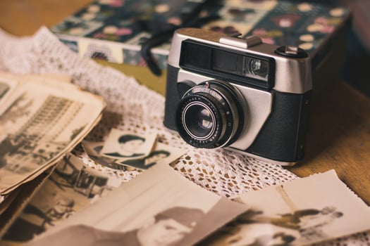 Vintage camera, photo album and several pictures