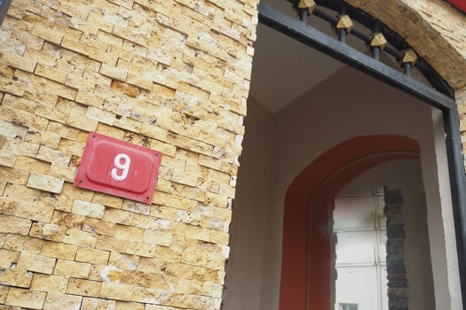 house number nice. Decorative lettering on a brick wall. photo