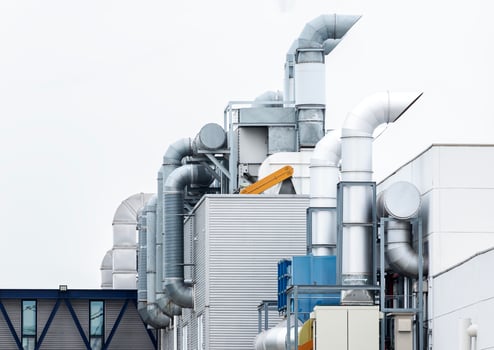 Chimney ventilation system on outside industry building photo