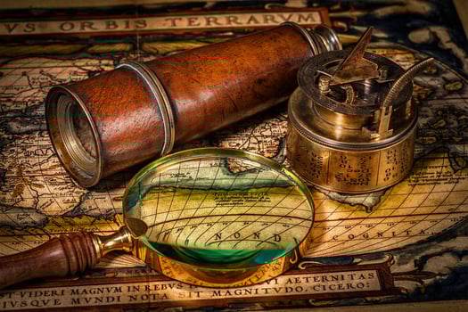 Old vintage compass on ancient map photo