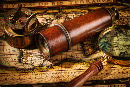 Old vintage compass on ancient map photo