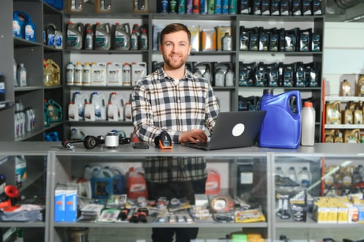 Smiling Salesman Auto Parts Store photo