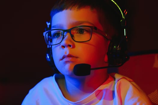 young man playing computer games on line photo