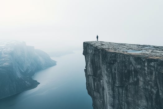 AI generated Man standing on the edge of cliff at sunrise. photo