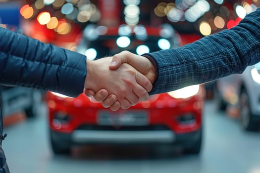 AI generated Good deal handshake close up on blurred background of new car for sale in a showroom photo