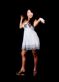 Smiling Asian American Woman Standing In Dress photo