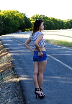 Asian American Woman In Shorts On Bike Path photo
