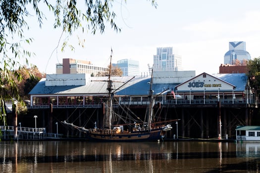 Sacramento, CA, 2015 -Hawaiian Chieftain Tall Ship On Sacramento River With Reflections In Water photo