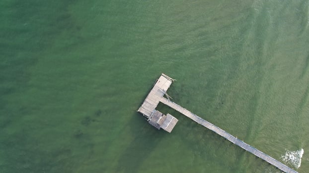 Aerial view of wooden pier in the sea photo