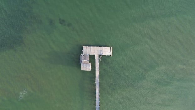 Aerial view of wooden pier in the sea photo
