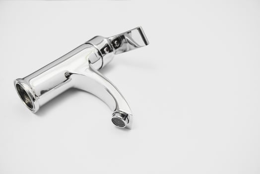 Single handle water tap isolated on white photo