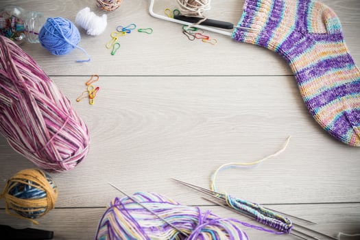 Colored threads, knitting needles and other items for hand knitting photo