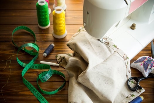 Sewing machine with fabric and threads for sewing, close-up. The working process photo