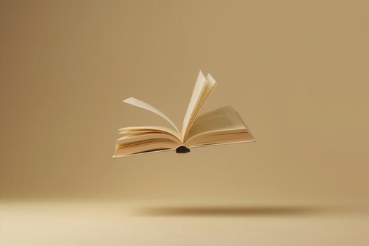 AI generated Open book is floating in the air casting a shadow over an beige background photo