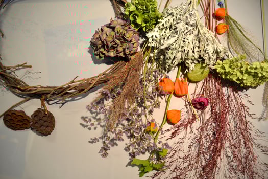 Dried flowers on a desk. The tools for decoration. photo