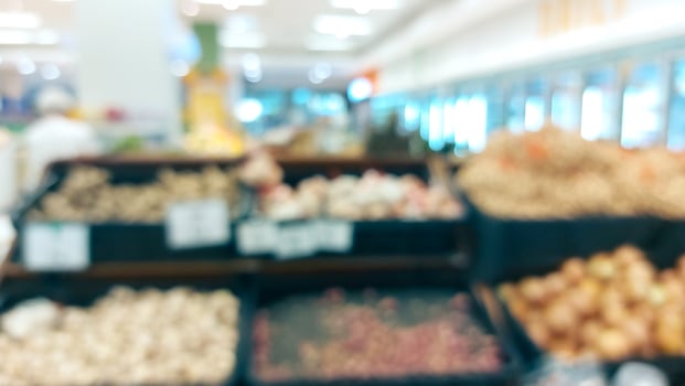 supermarket aisle and shelves blurred background. grocery store retail business concept photo