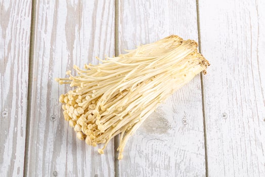 Tasty raw enoki mushroom heap photo