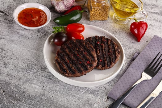 Grilled burger cutlet with sauce photo