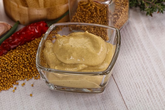 Dijon mustard sauce in the bowl photo
