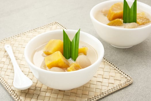 Kolak Ubi, Indonesian traditional dessert, made from sweet potato, coconut milk, sugar and pandanus leaves. photo