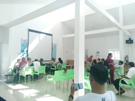 elderly people are sitting on green chairs queuing for health checks at the community health center. regular elderly health checks at semarang march 12 2024 photo