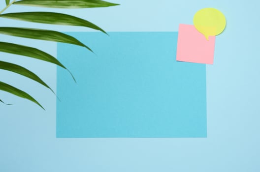 Blank rectangular sheet of paper on a blue background photo
