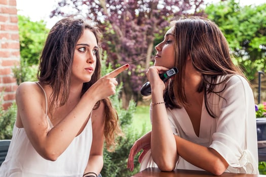 two young female friends having fun singing a new song photo