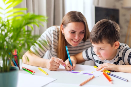 Mother and her son drawing together photo