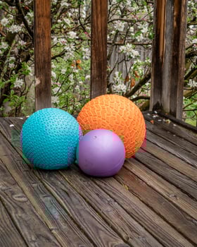 heavy slam balls filled with sand on a backyard deck, exercise and functional fitness concept photo