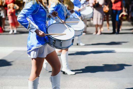 group of majorettes parade through the streets of the city photo