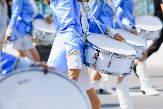 group of majorettes parade through the streets of the city photo